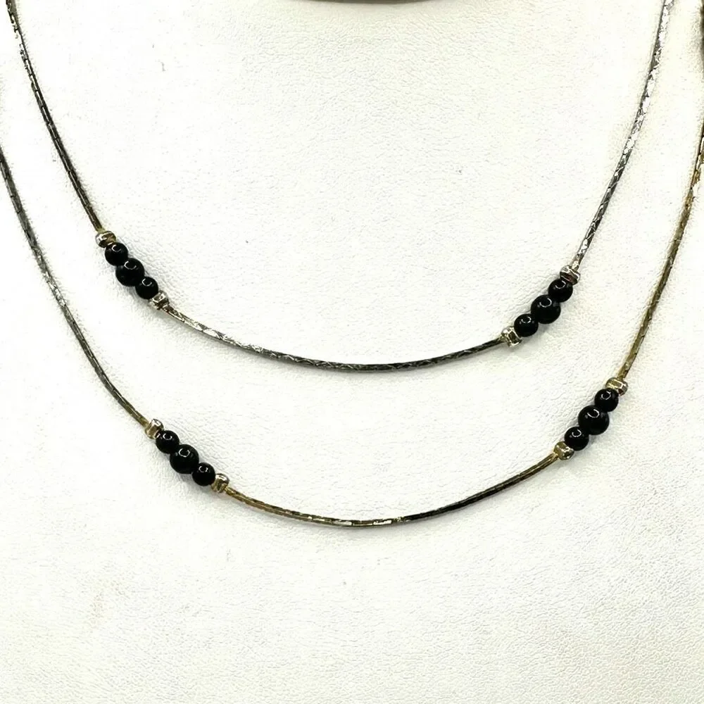 Black and silver tone long beaded necklace